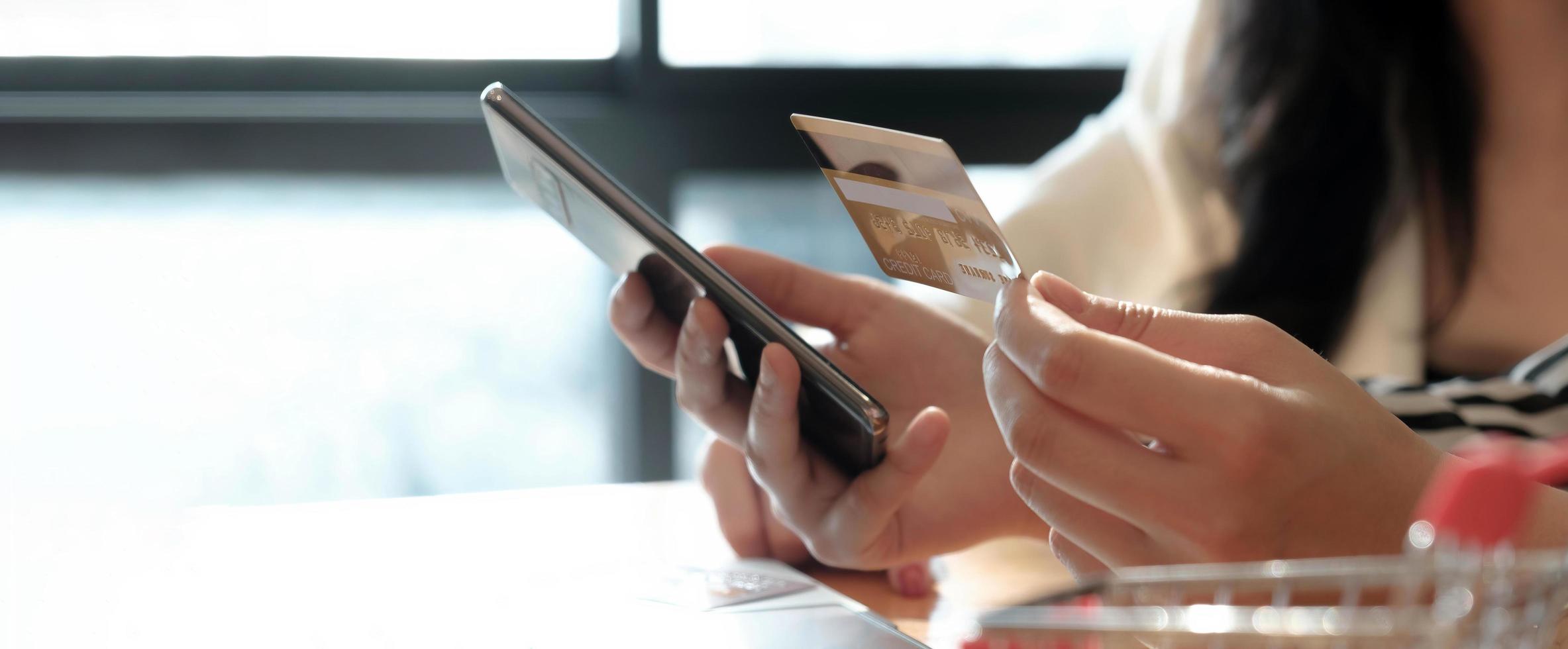 Woman making a payment on her phone photo