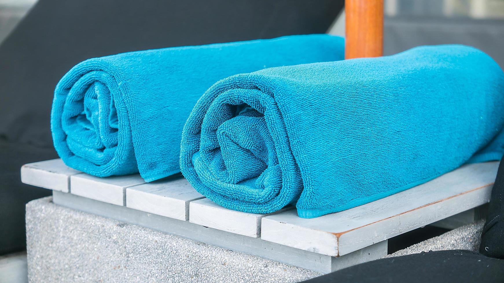 Towels on a chair at the pool photo