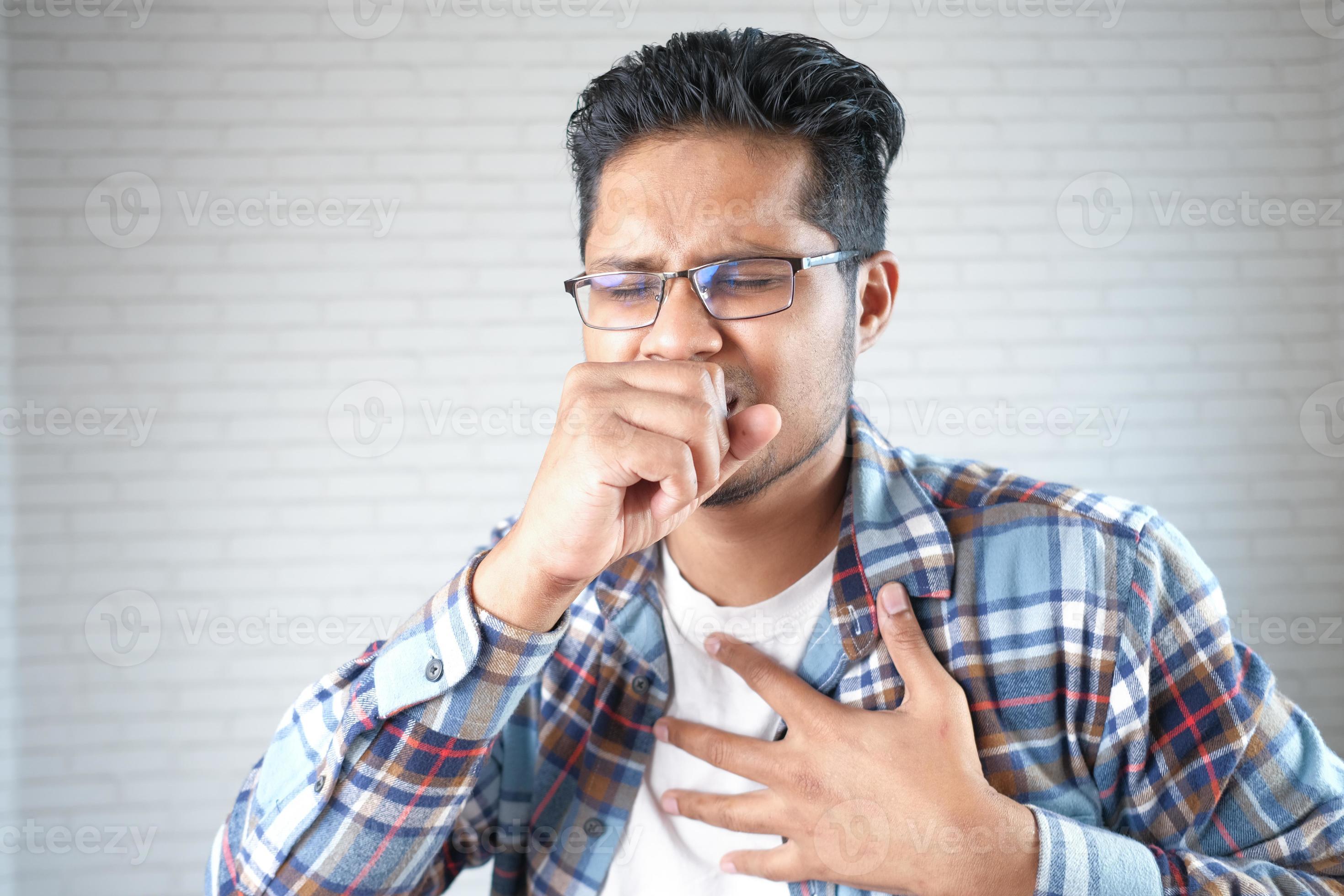 Man coughing into hand 2295742 Stock Photo at Vecteezy