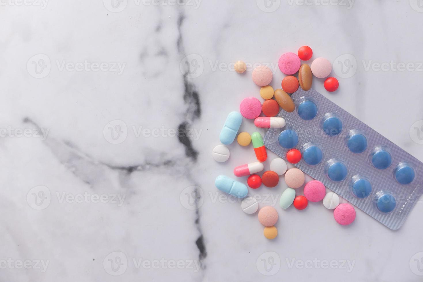 Pills on a marble surface photo