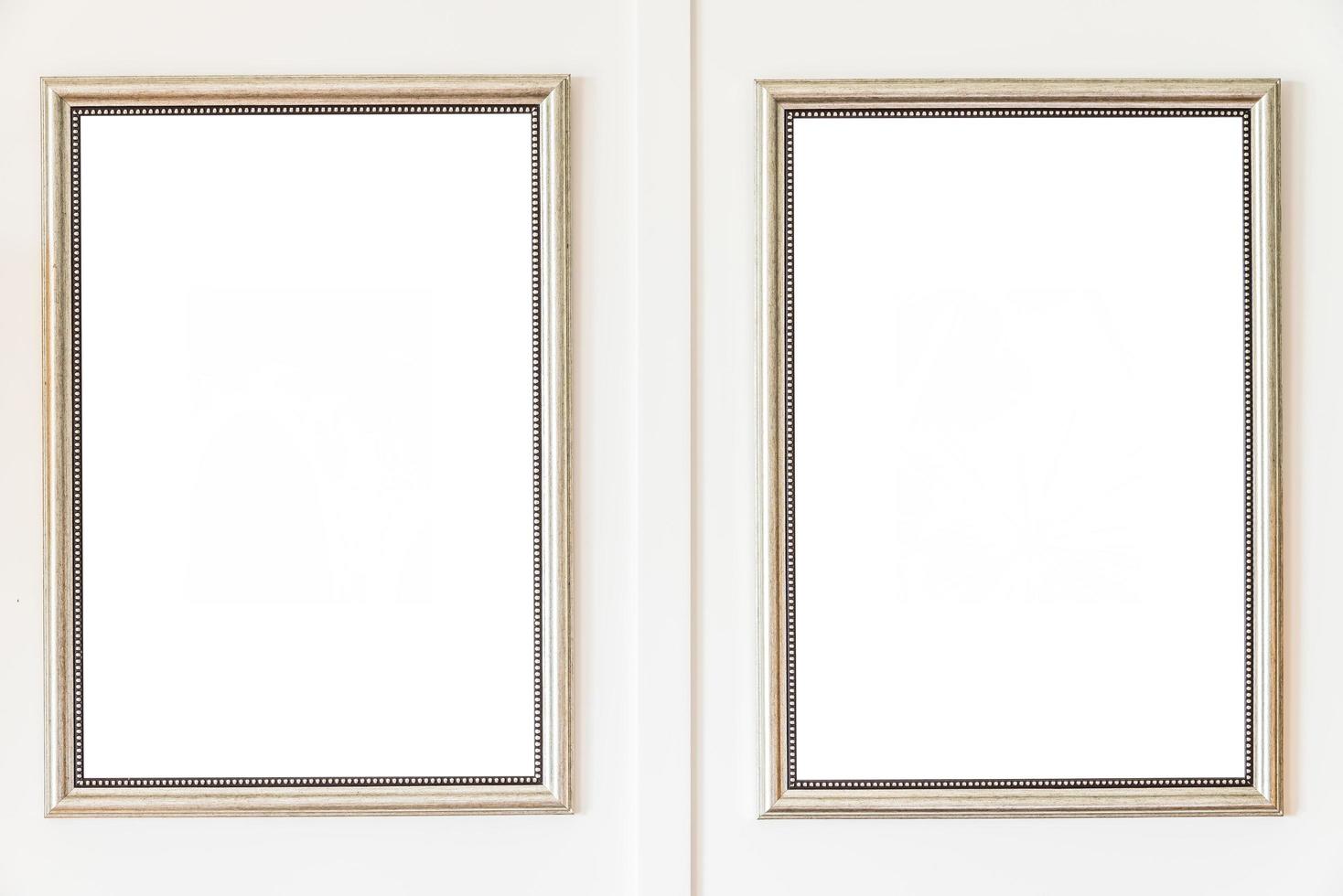 Blank frames on white wall background photo