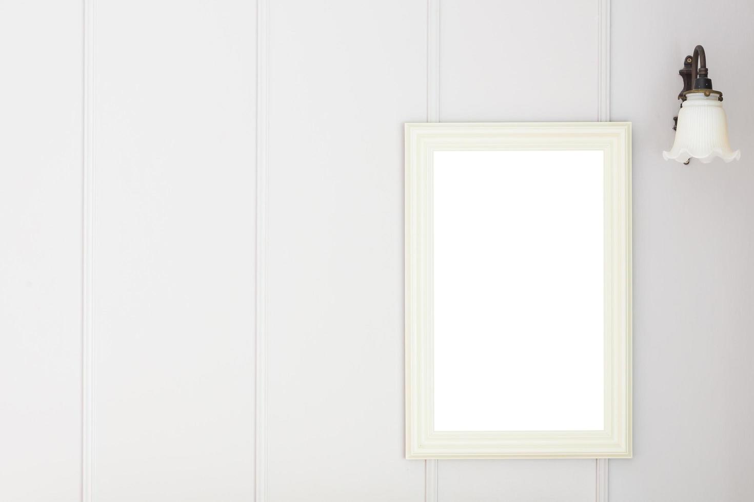 Blank frame on white wall background photo