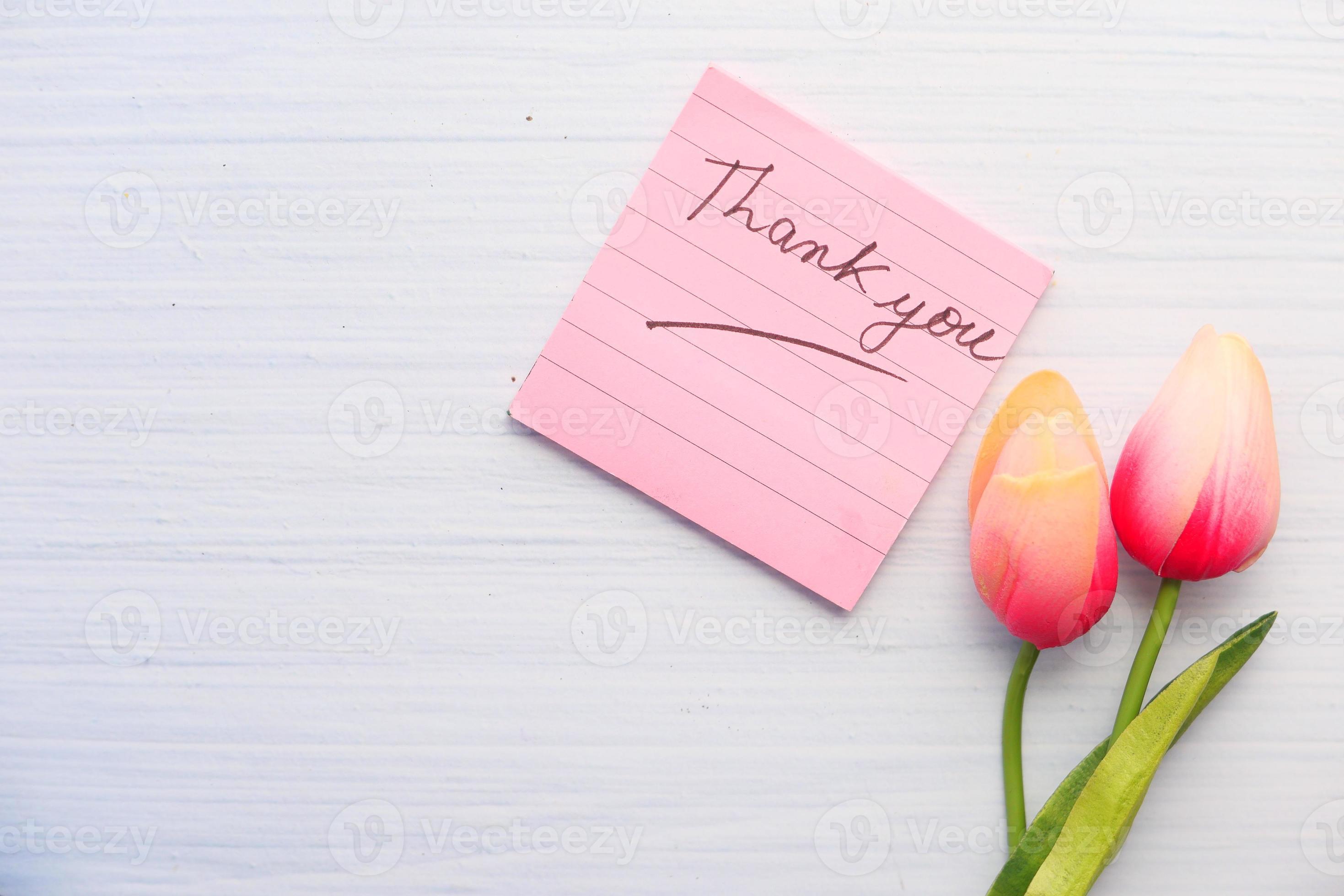Thank you sticky note with tulips on white background 2296559 Stock