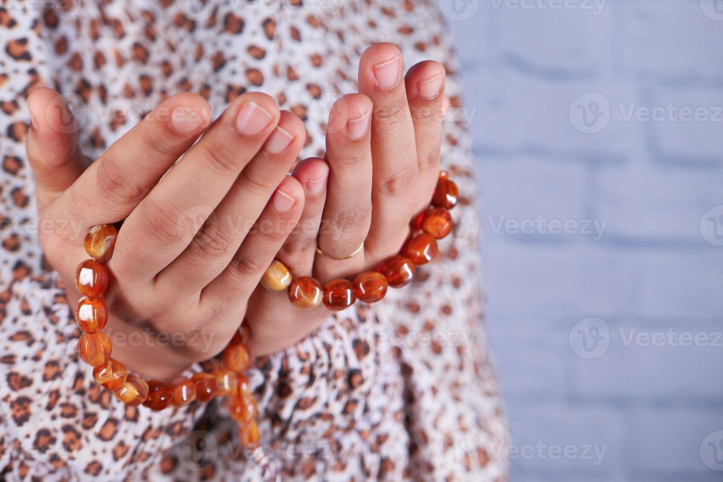 Prayer beads with hands photo