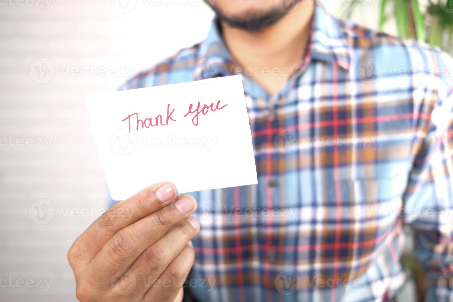 Man holding a thank you note photo