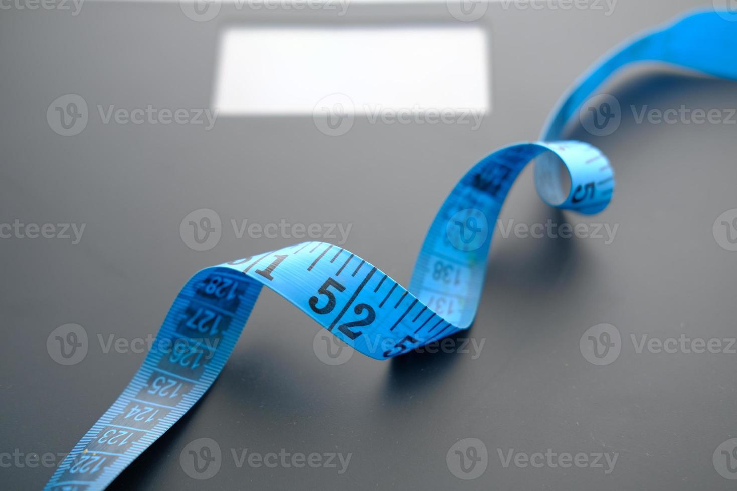Measuring tape on a scale photo