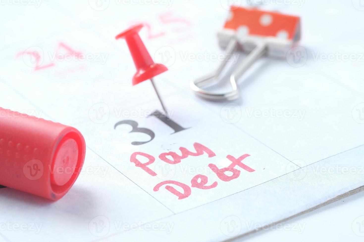 Pay debt on calendar photo