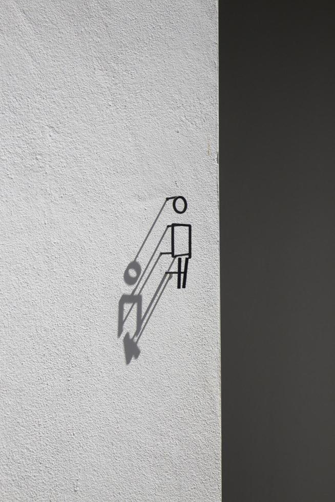 Modern sign of outdoor toilet with shadow photo