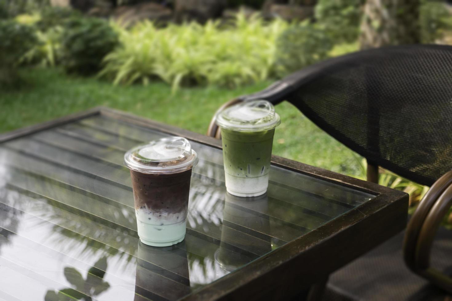 Glasses of green iced sweet milk drink photo