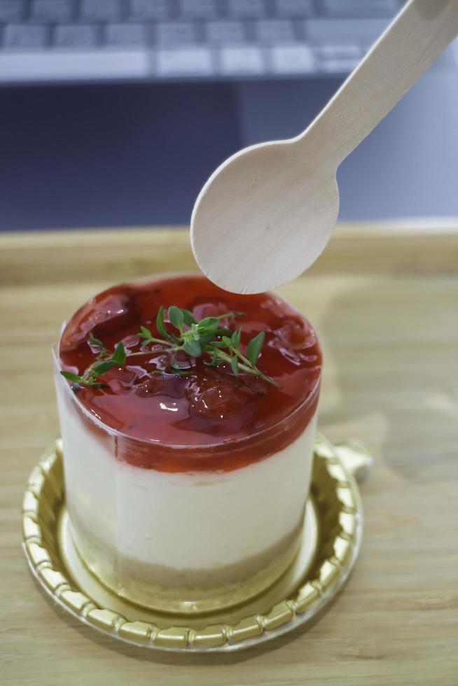 Spoon on a piece of chesse cake photo