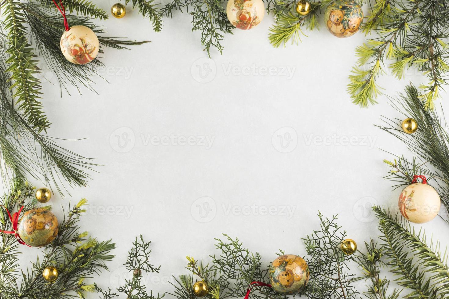 Christmas composition of branches with baubles photo