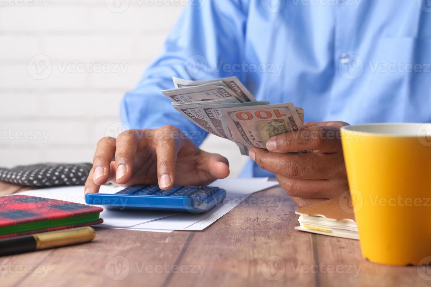 Person counting money photo