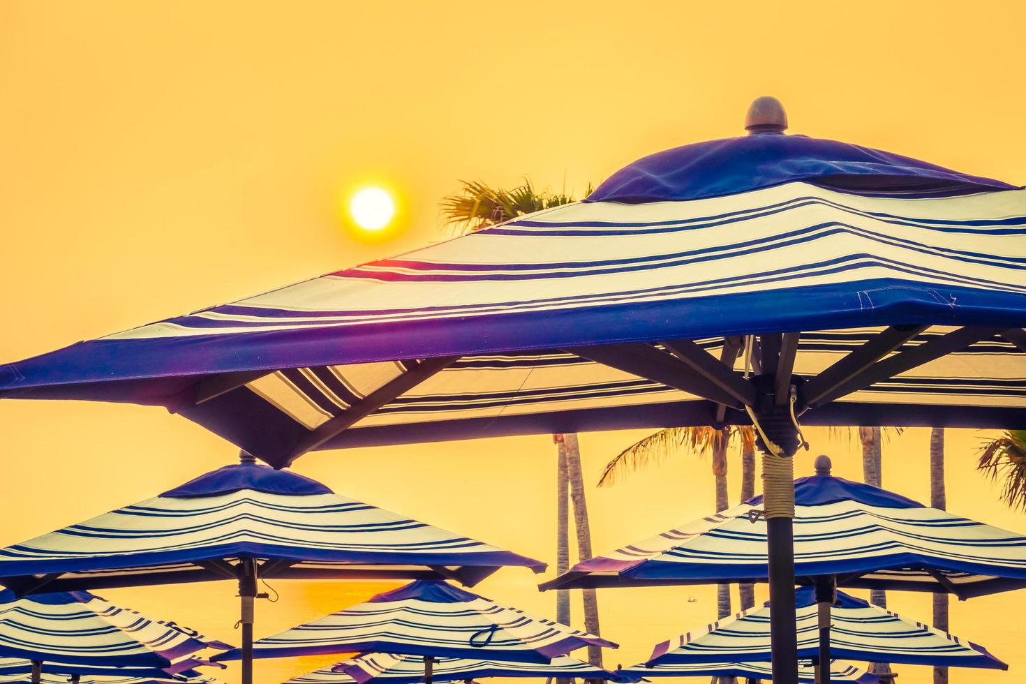 Umbrellas at sunset photo