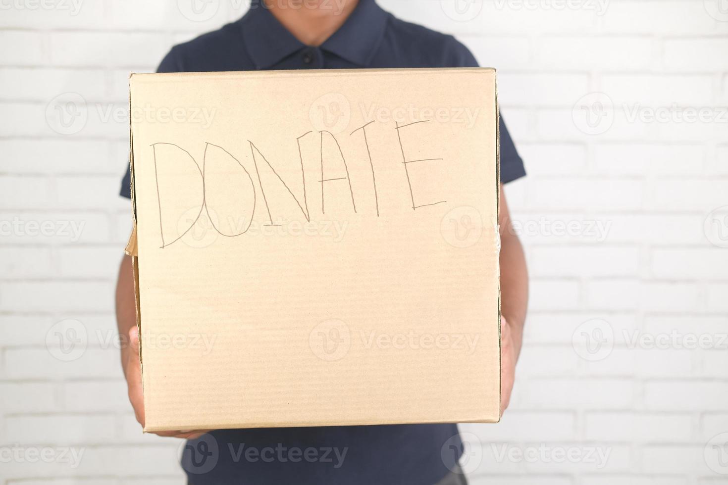 Man holding a donation box photo