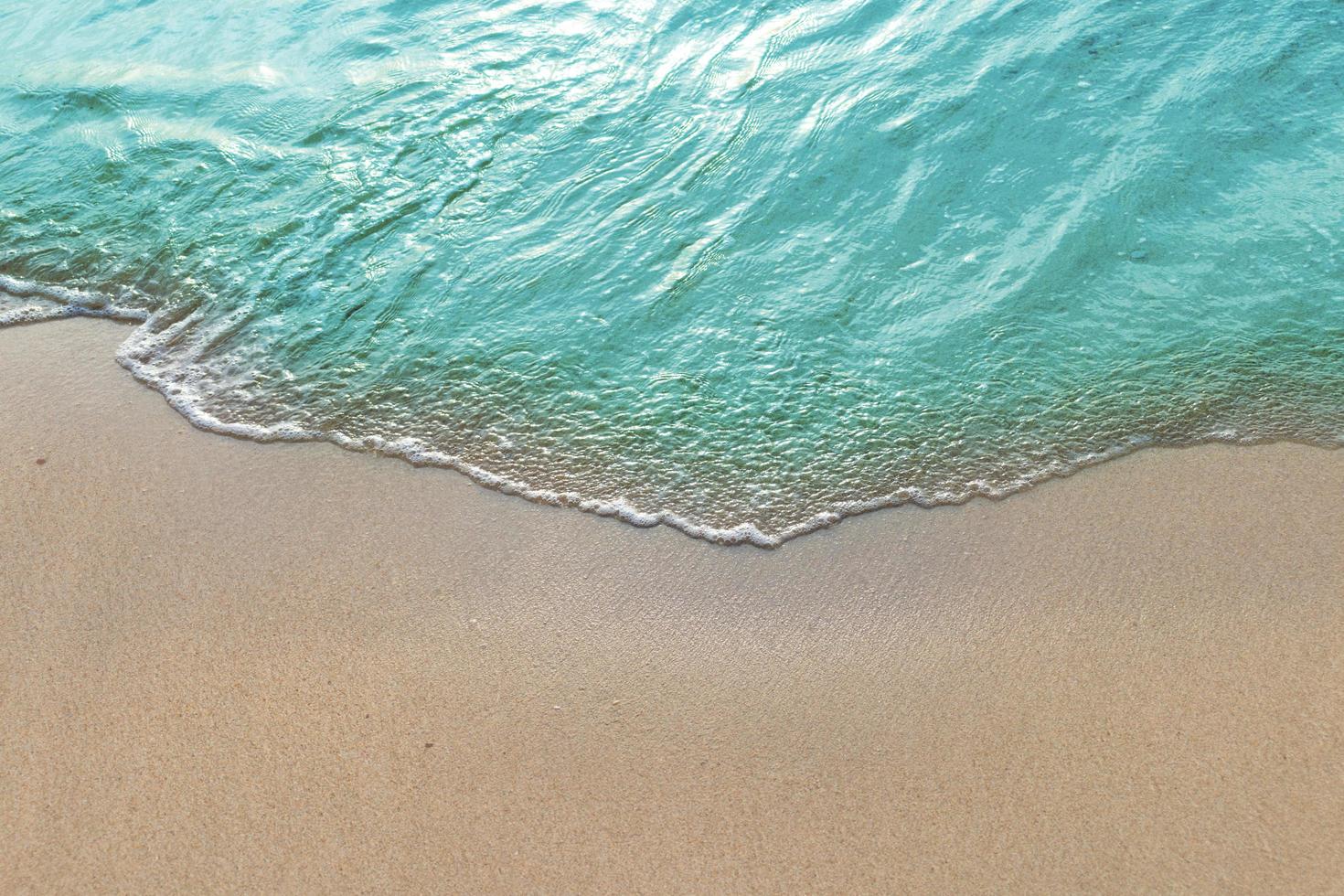 Turquoise wave on a tropical beach photo