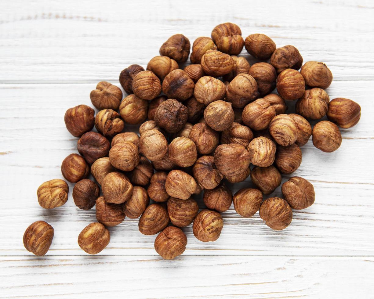 Peeled hazelnuts on table photo