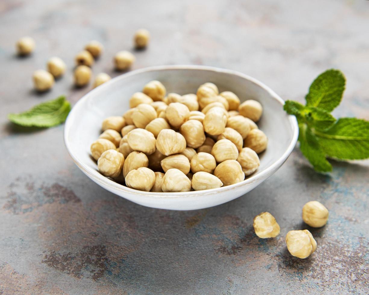 Peeled hazelnuts in bowl photo