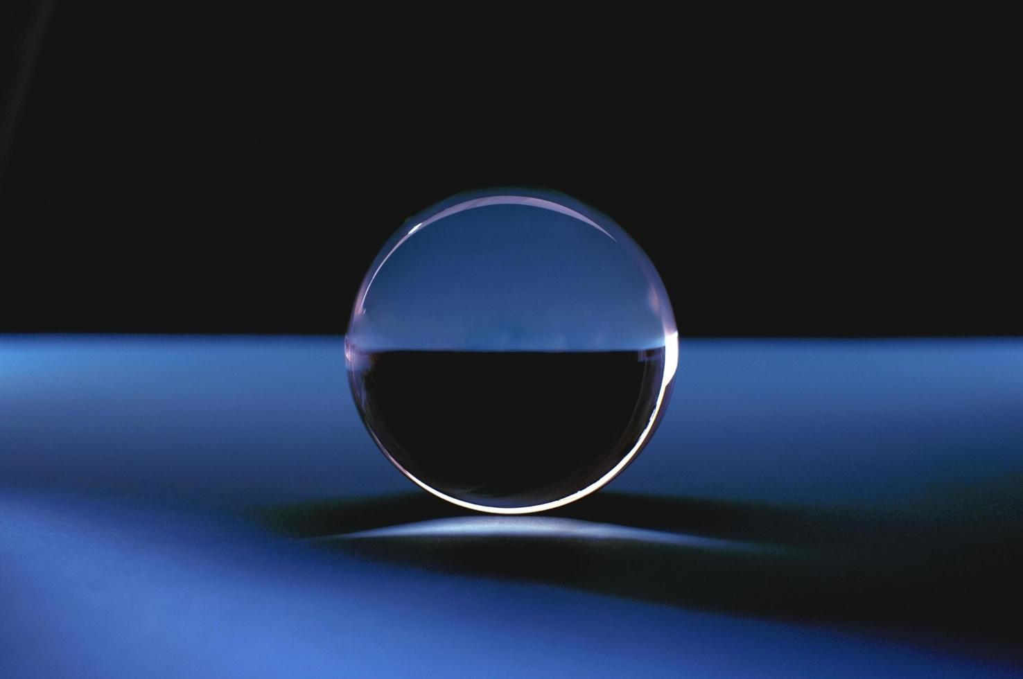Abstact crystal ball in blue and black. photo
