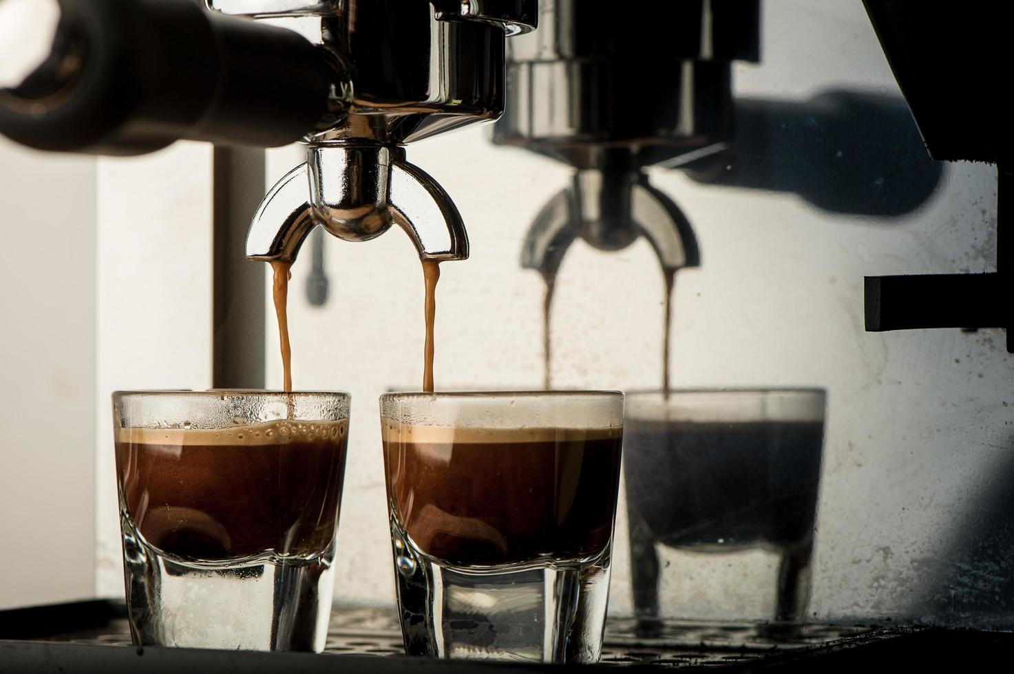 Espresso machine brewing a coffee photo