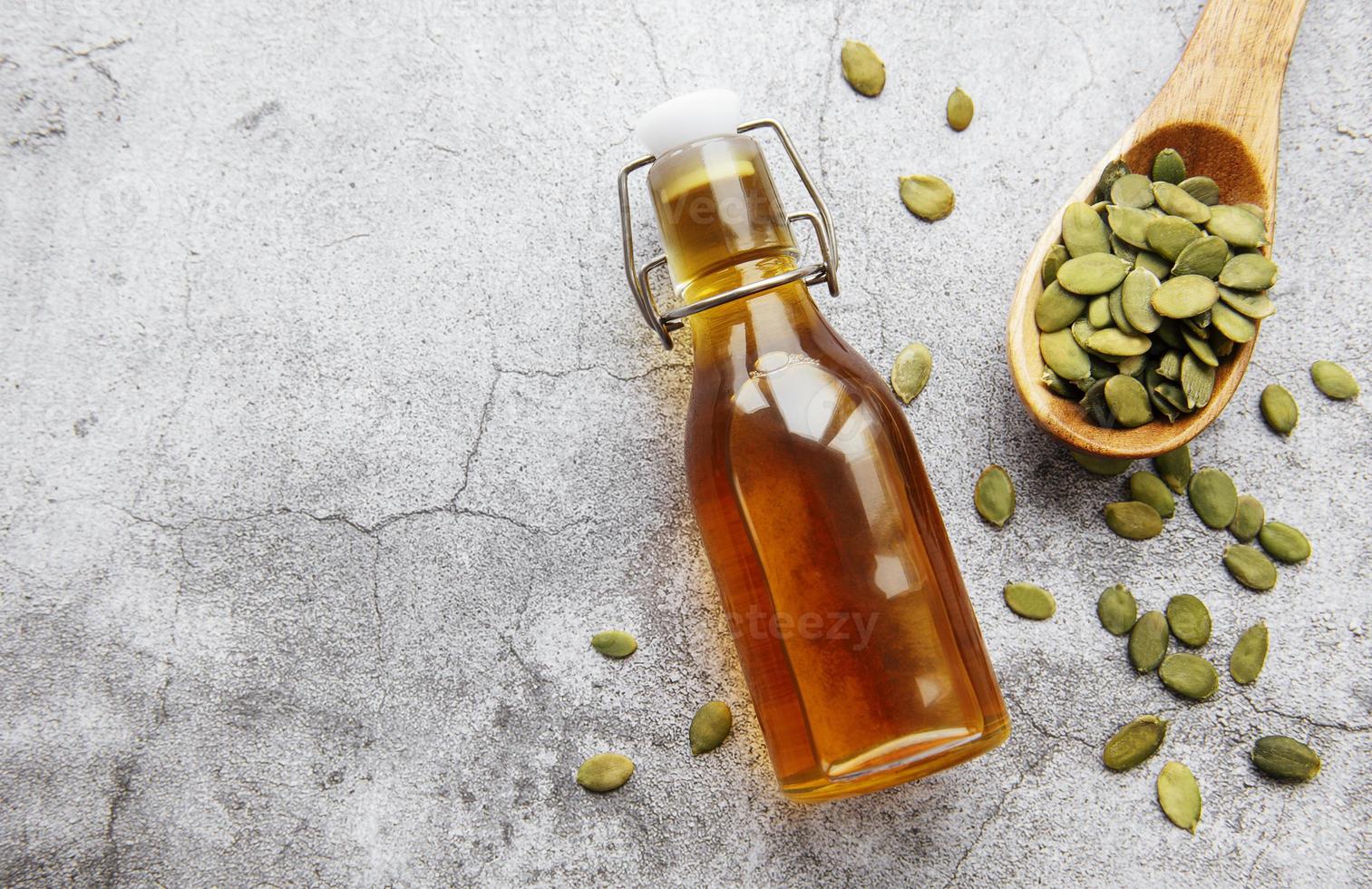 Bottle with pumpkin seed oil photo