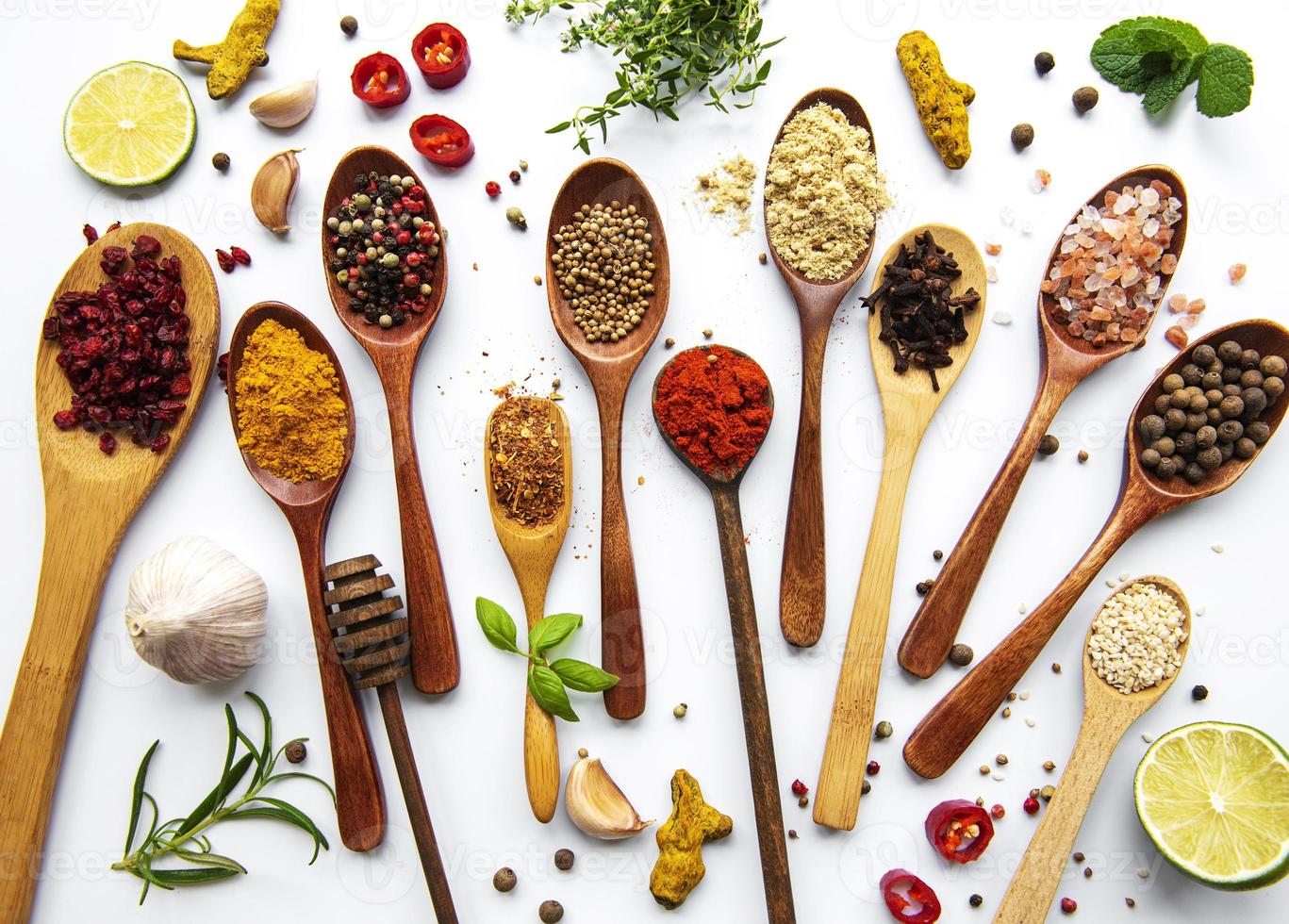 Various spices isolated on white background, top view photo