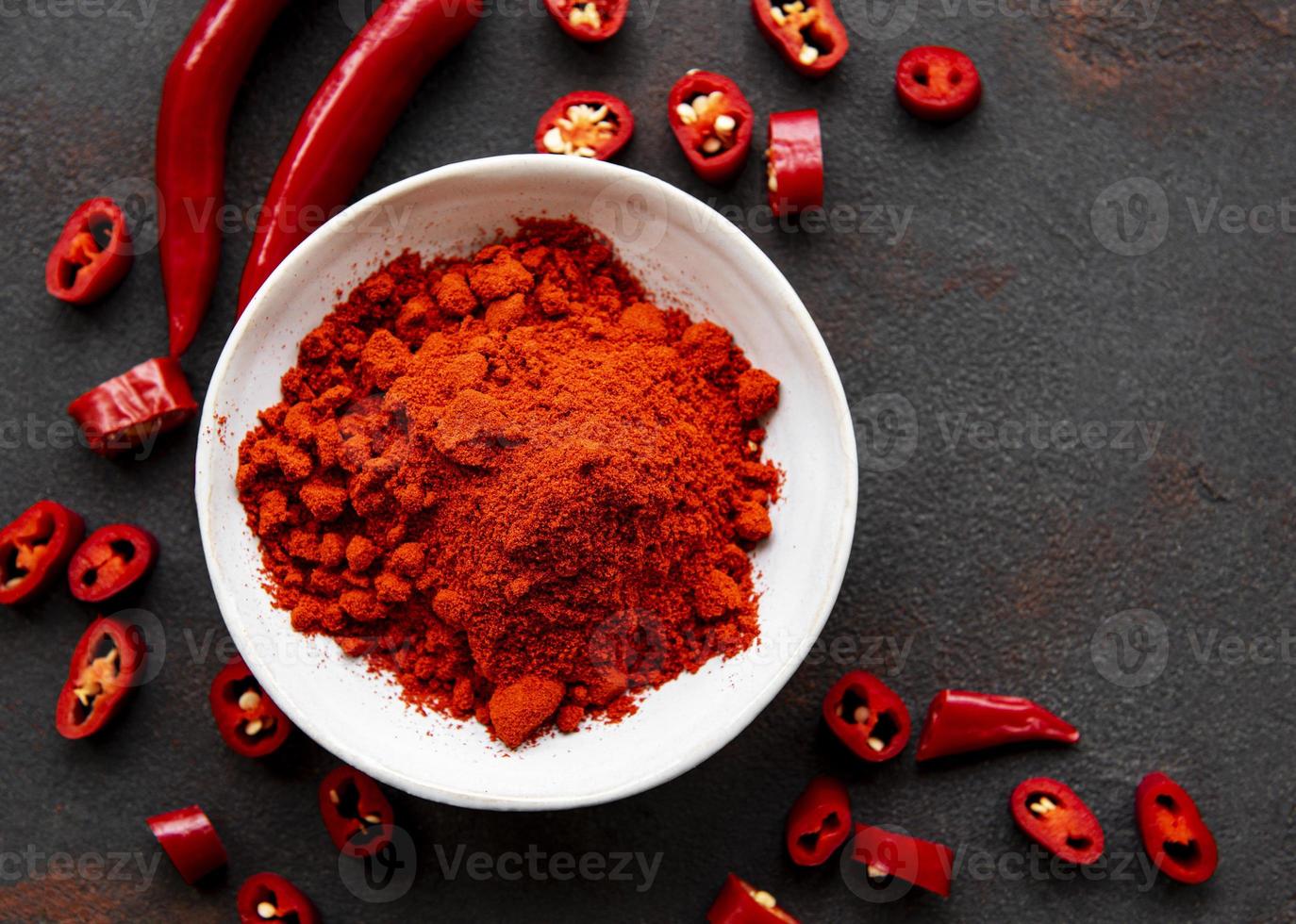 Red chili pepper, dried chillies on dark background. Top view photo