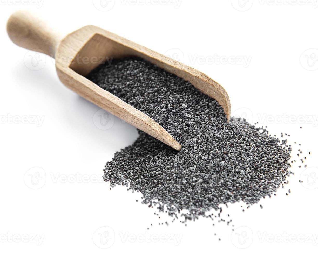 Poppy seeds in small wooden scoop photo