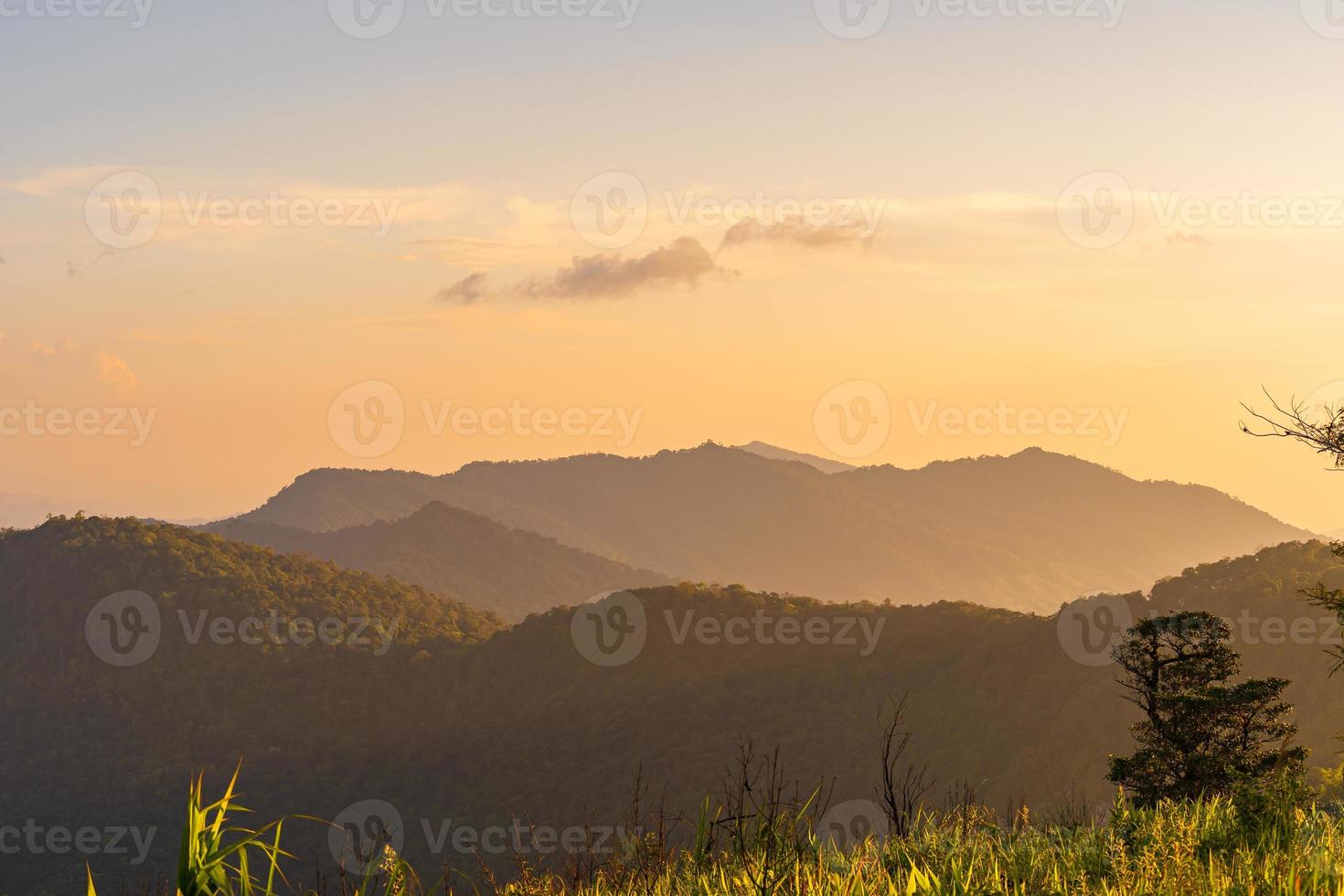 High angle viewpoint sunset over mountains and forest photo