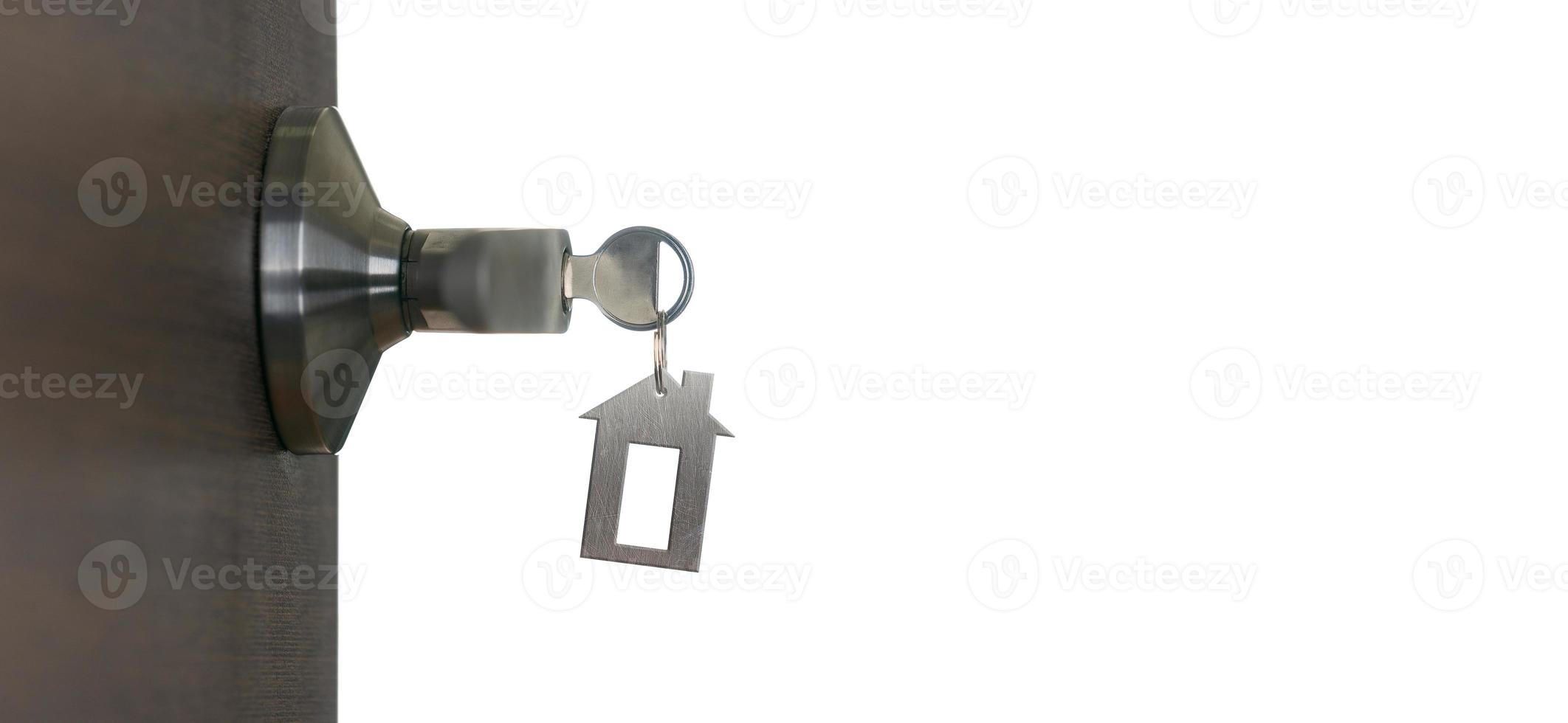 Open door at home with key in keyhole photo