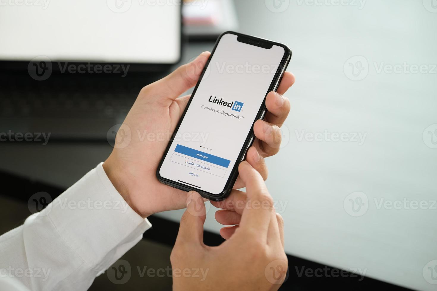 Chiangmai, Thailand, Apr 06, 2021 - Man using the LinkedIn app photo