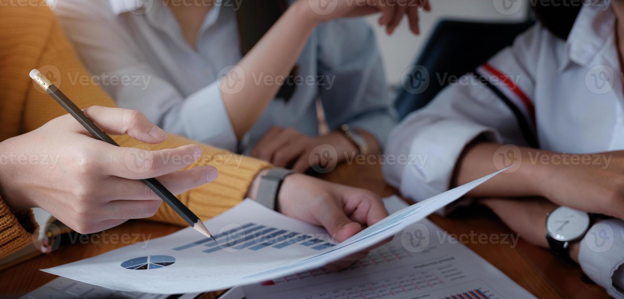 Group of businessmen and accountants checking data documents on a digital tablet for investigation of corruption accounts. Anti-bribery concept photo