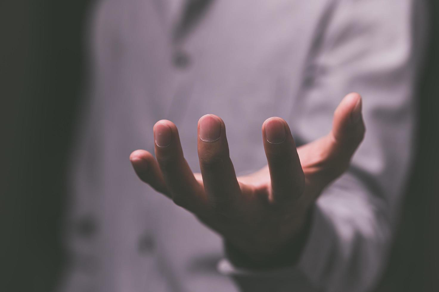 People pretending to spread their hands to hold things photo