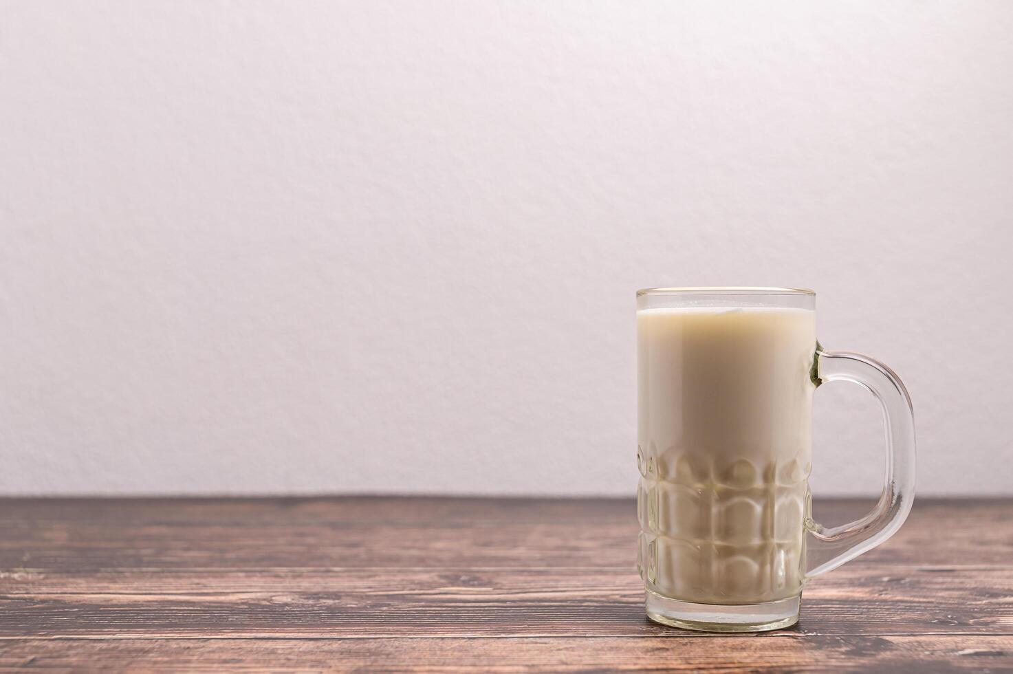 A glass of milk on the desk photo