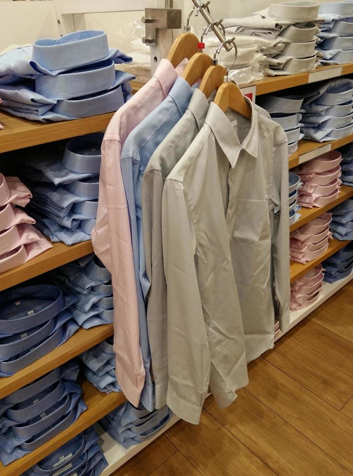 Mens shirt hanging in a clothing store photo