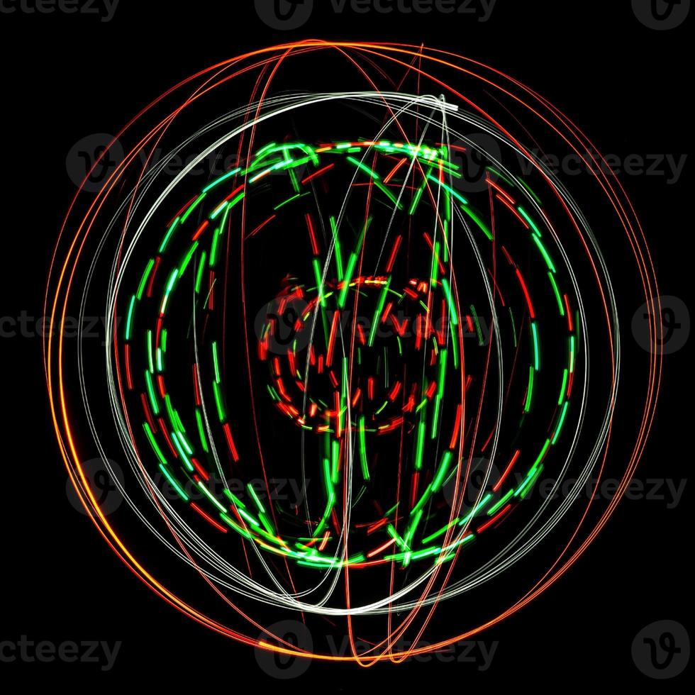 Abstract structure of colored light painting against a black background photo