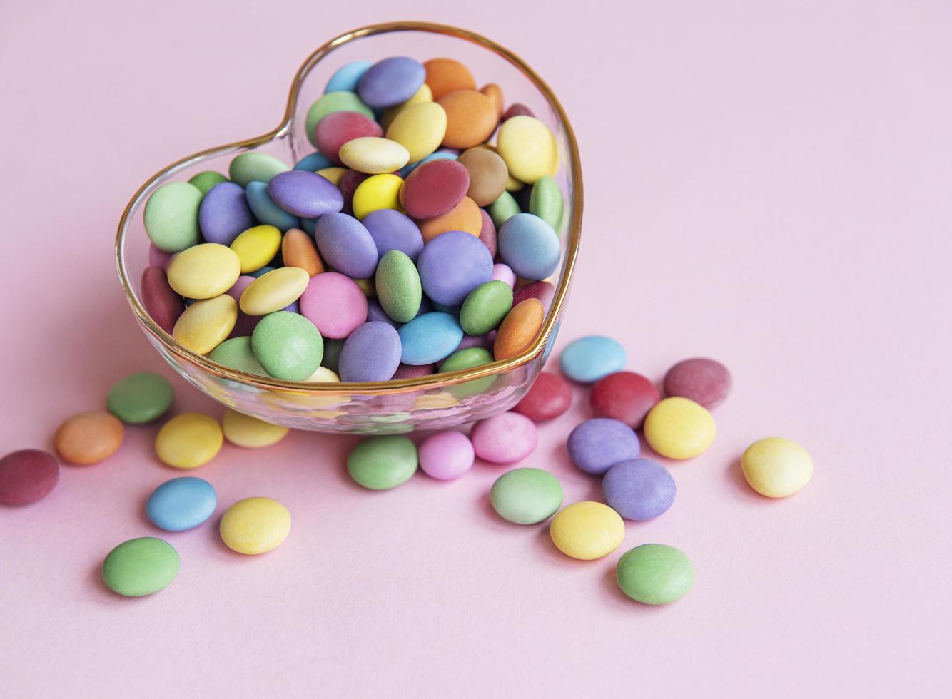 Bowl with multicolored dragee candie photo