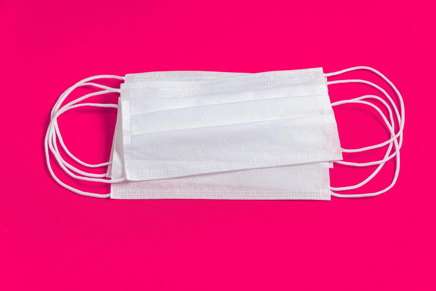 Surgical mask over minimalist pink background 2310734 Stock Photo at