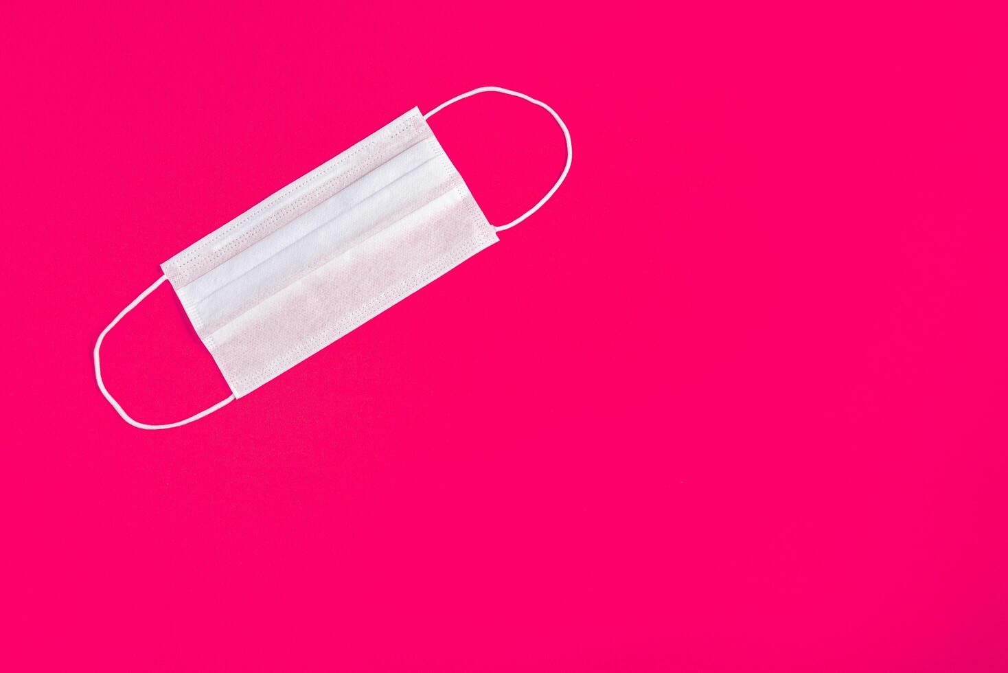 Surgical mask over minimalist pink background 2310736 Stock Photo at