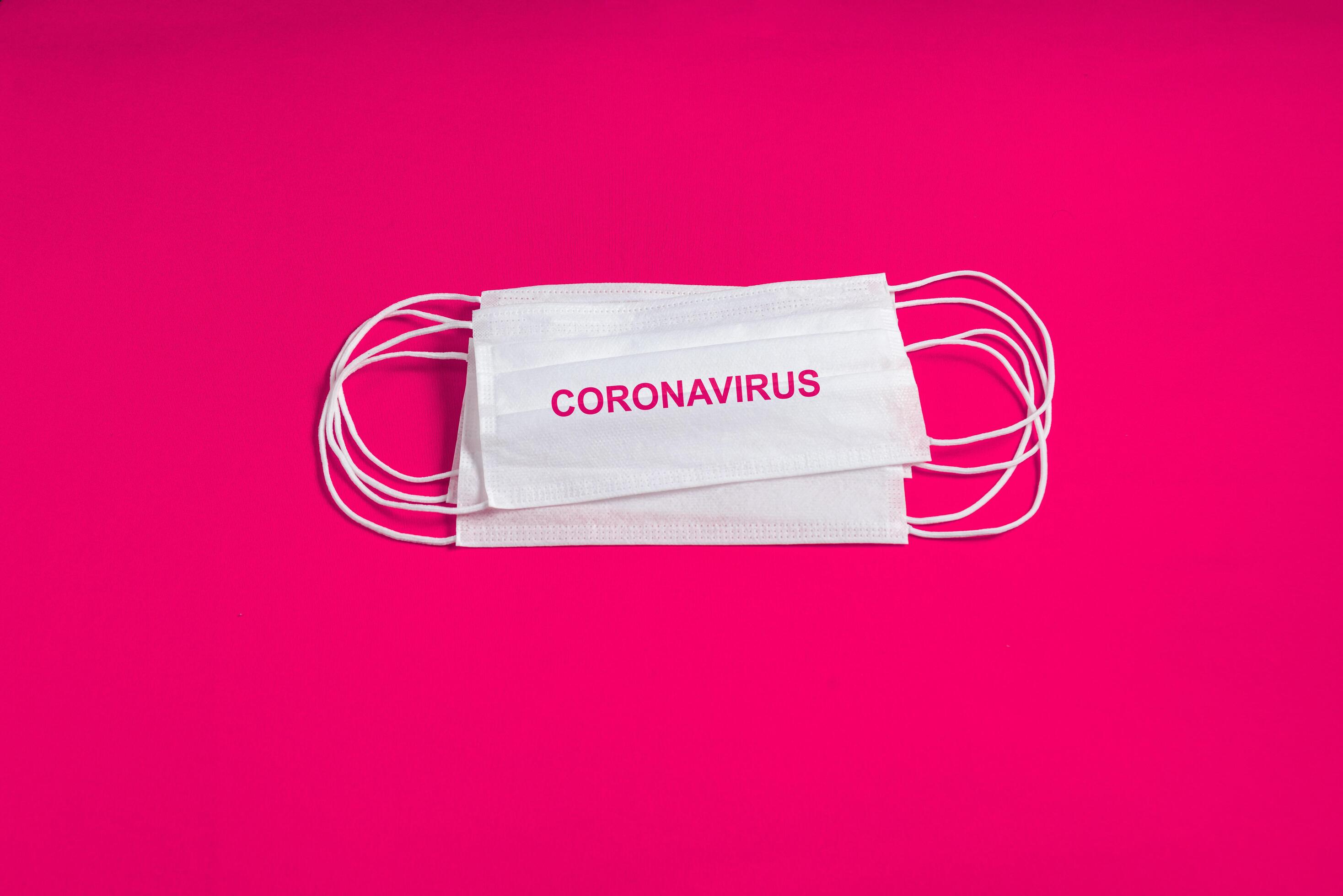 Surgical mask over minimalist pink background 2310743 Stock Photo at
