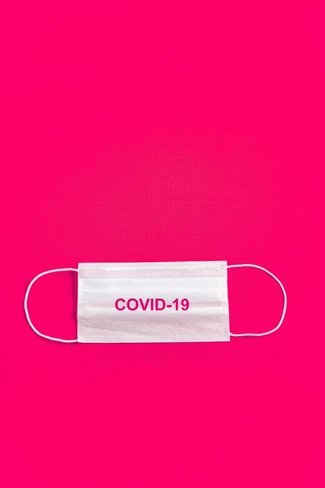 Surgical mask over minimalist pink background 2310752 Stock Photo at