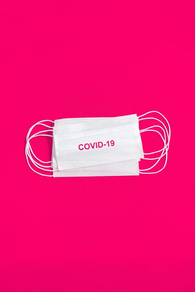 Surgical mask over minimalist pink background 2310755 Stock Photo at