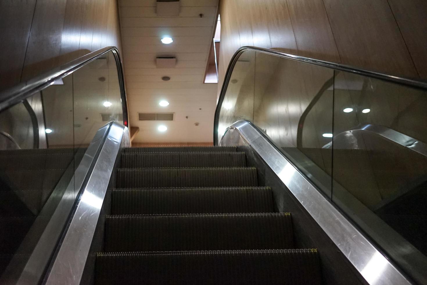 Stairs escalator in the dark room of the sea ferry. photo