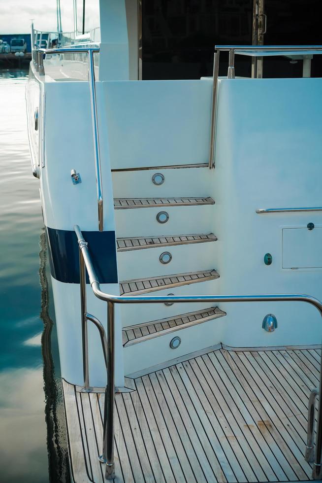 Details of the hull of a white yacht photo