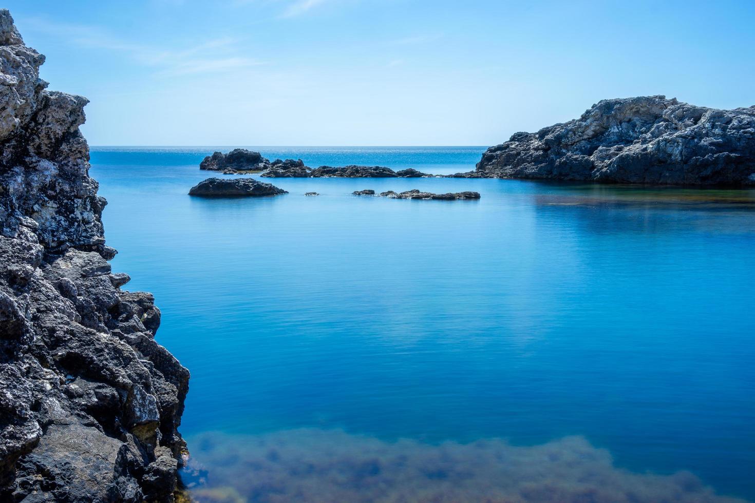 Beautiful view of us we are with the rocky shore of the black sea photo