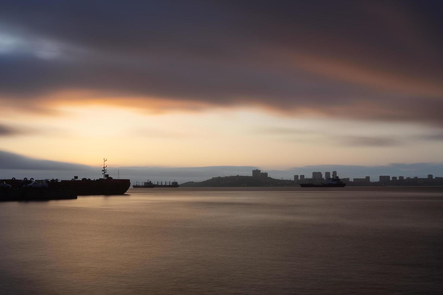 Seascape at sunset on the background of the coastline of Vladivostok photo