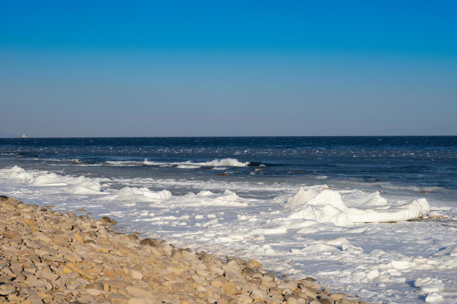 Seascape with coastline in ice and snow photo