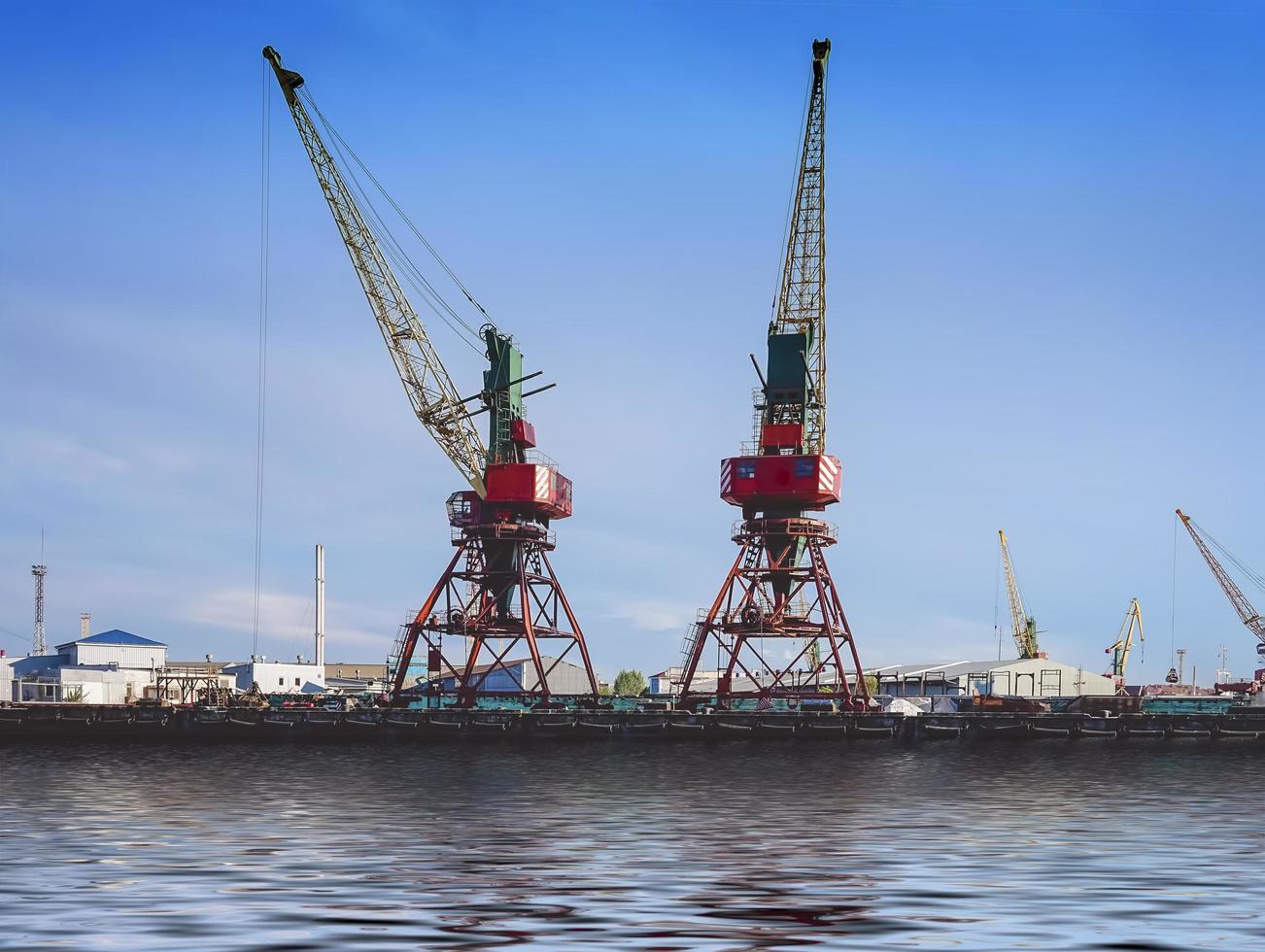 Port of a large Russian city with ships and various equipment on photo