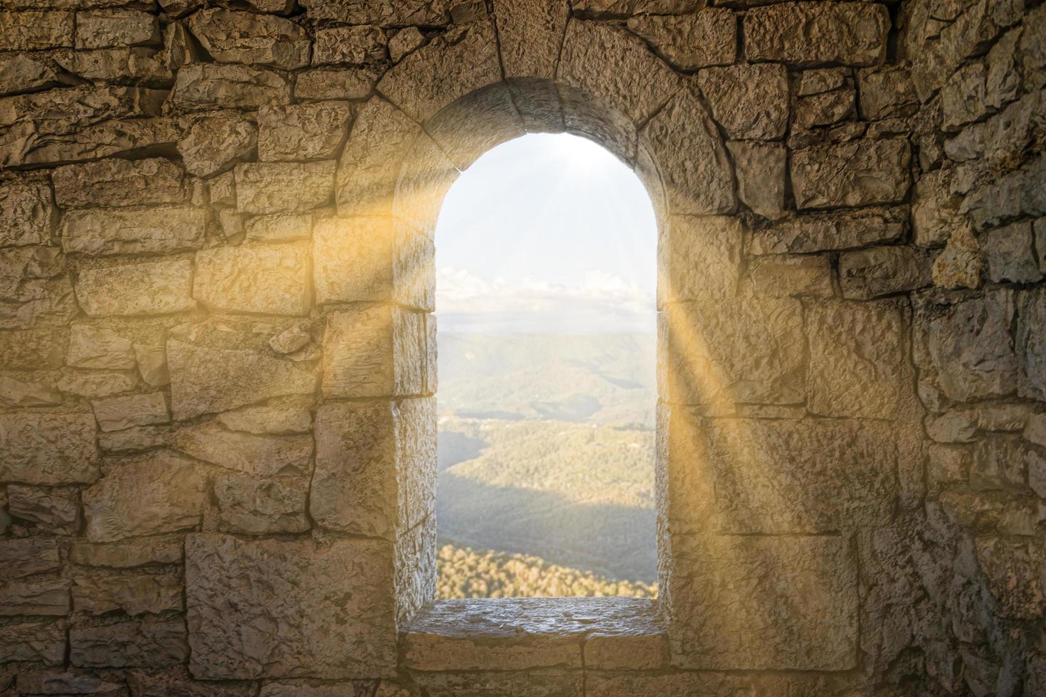 Window in a stone wall photo