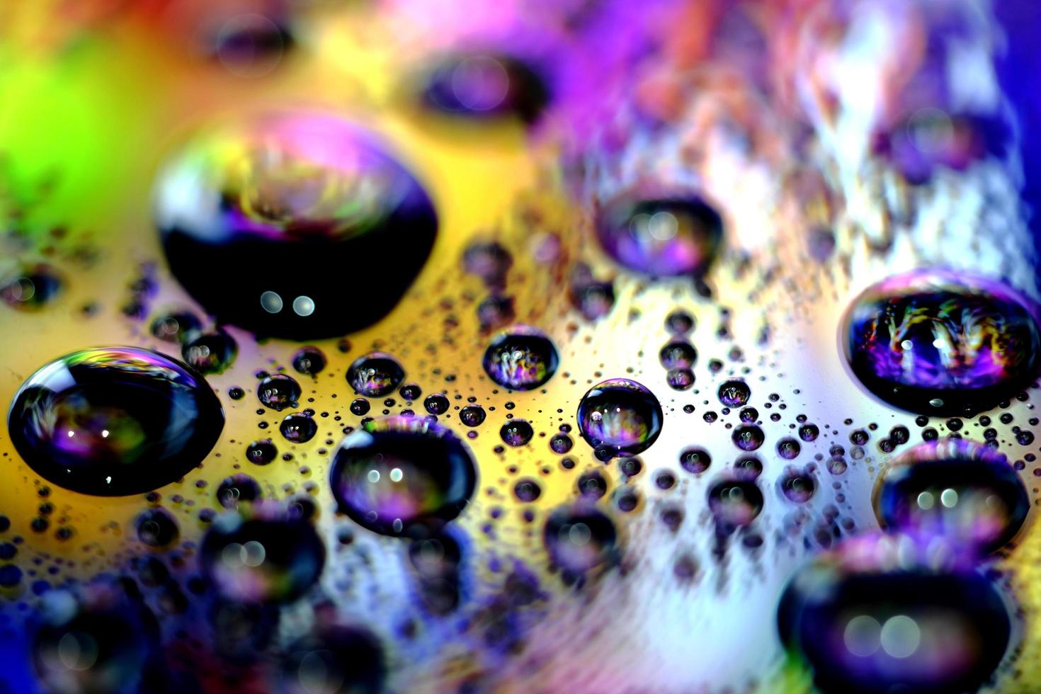 Macro image of droplets on shiny surfae. photo