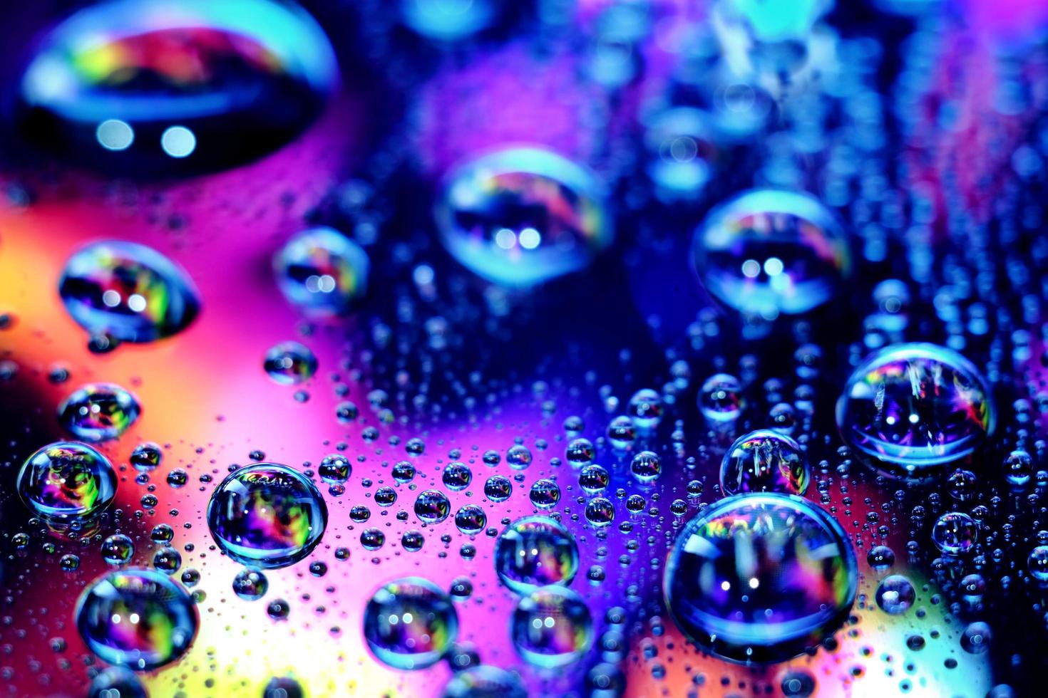 Macro image of droplets on shiny surfae. photo